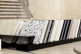 Countertop material samples including quartz, granite, marble, and other stain-resistant surfaces